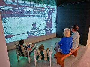 family watching a projection at the cairns museum