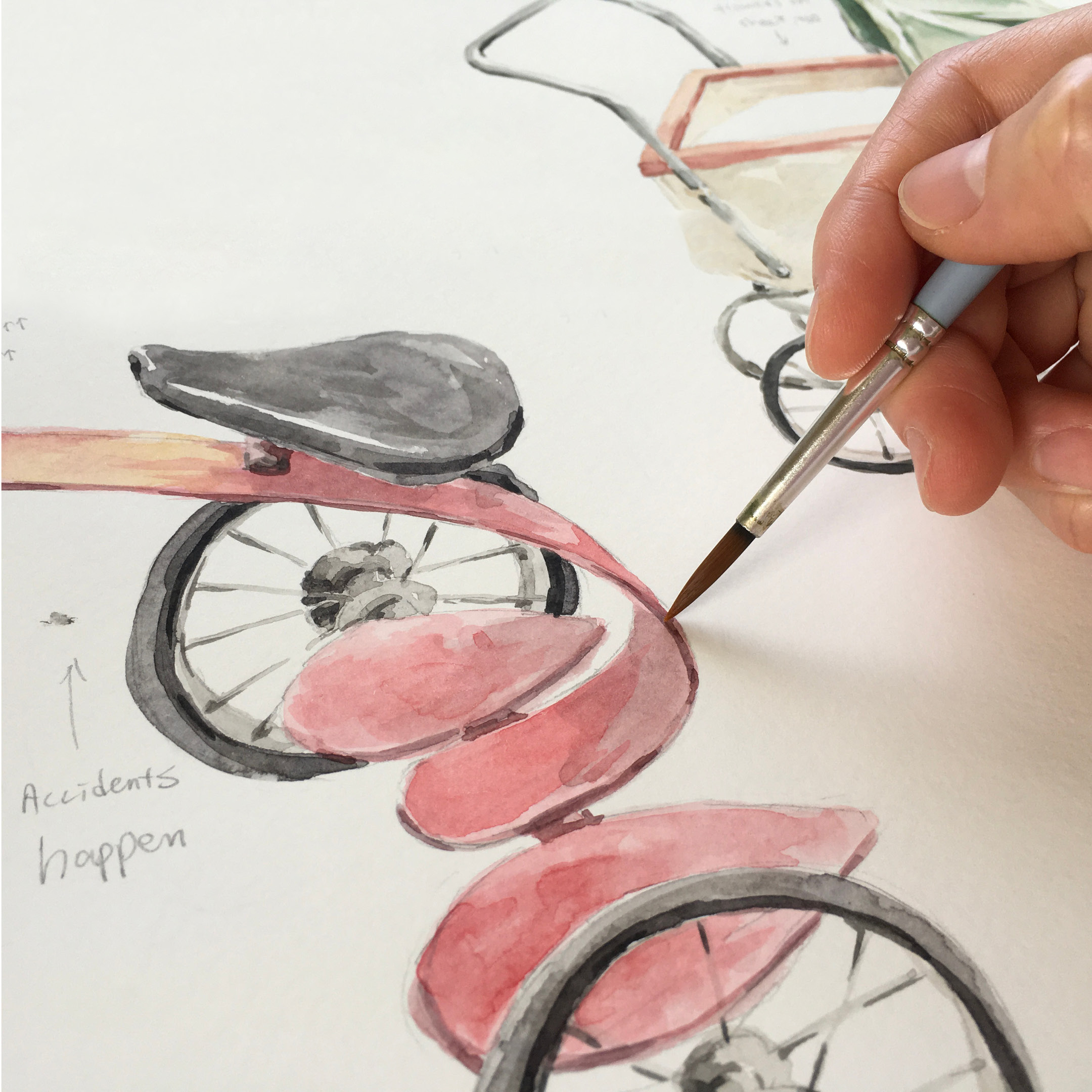 person painting water colour art of a bicycle